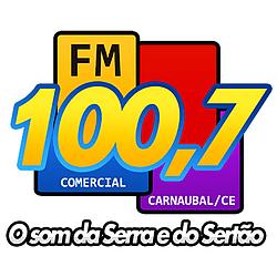 100.7 FM Comercial logo